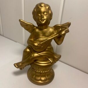 Vintage gold cherub figurine winged angel boy playing instrument small statue